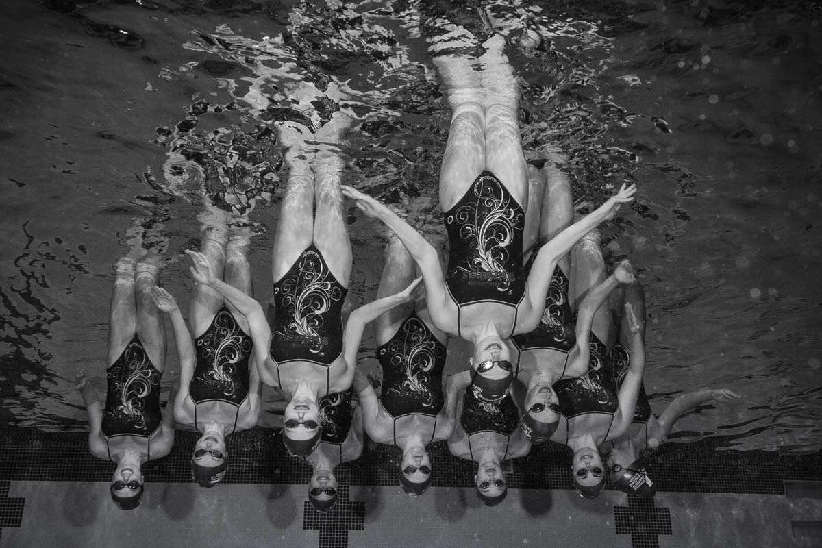 Syncronized swim team underwater pyramid